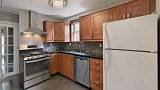 010-Kitchen-With-Stone-Countertops-and-Tile-Backsplash.jpg